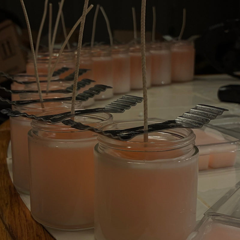 picture of some candles being made along with wax melts in the background