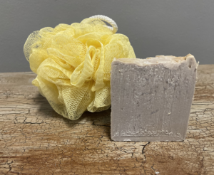 Picture of oatmeal natural soap with yellow mess loofah